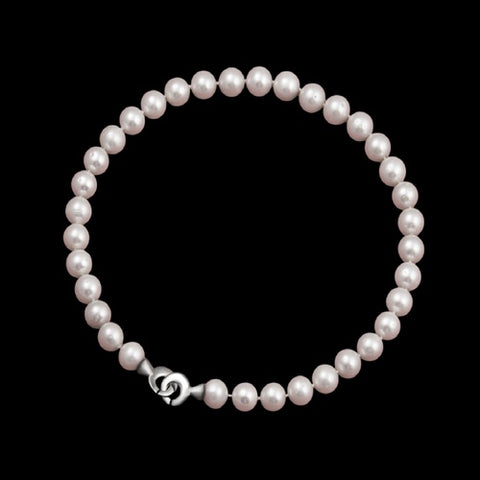 Collar de perlas en rosa